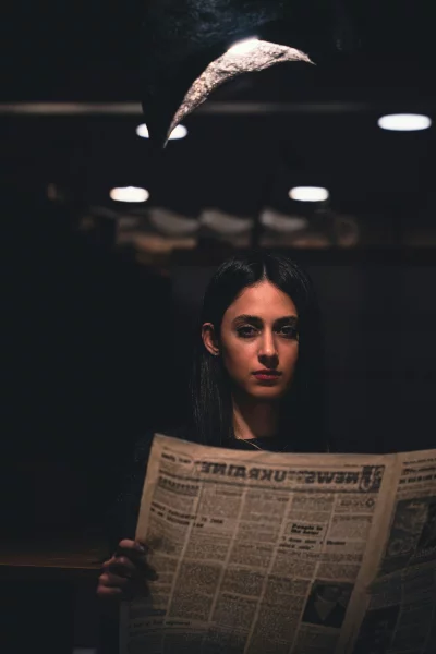 Mysterious Woman Reading Old Newspaper