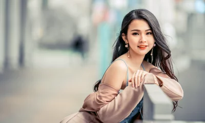 Elegant Asian Woman Posing Confidently in Urban Outdoor Setting image