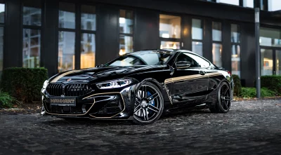 Luxurious Black Manhart MH8 600 Sports Coupe on City Street at Night image