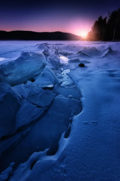 Dramatic Arctic Winter Landscape: Fractured Ice Formations on Frozen Lake at Sunrise image