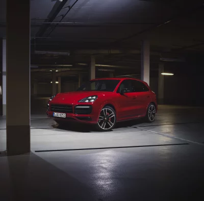 Red Porsche Cayenne GTS SUV Parked in Dark Garage image