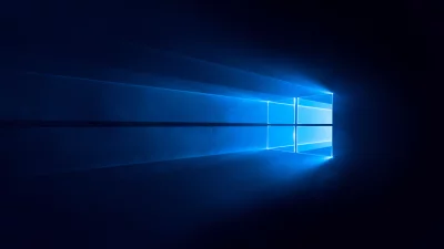 Official Windows 10 Logo with Glowing Light Beams on Dark Blue Background image