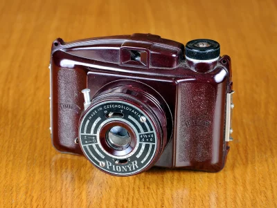 Vintage Czechoslovakian Pionýr Film Camera on Wooden Surface image