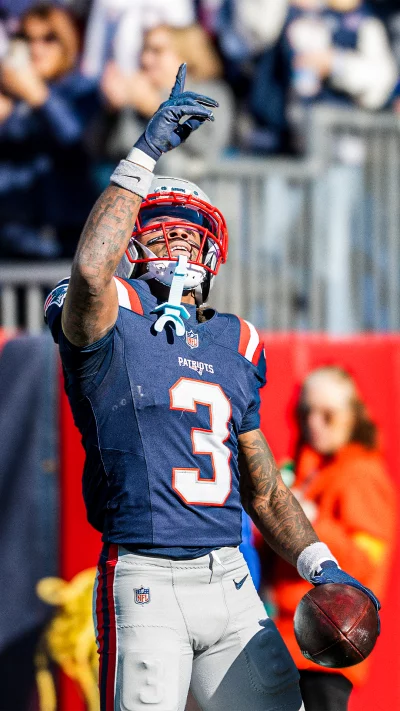 New England Patriots player celebrates scoring a touchdown