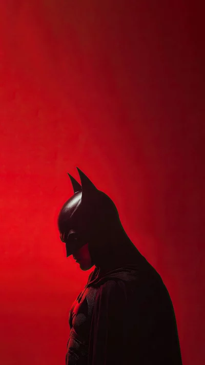 Batman Silhouette in Dramatic Red Lighting, Iconic Superhero Portrait