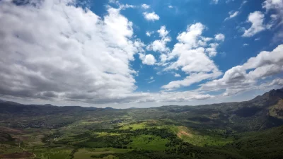 Expansive Landscape Under a Dramatic Cloudy Sky