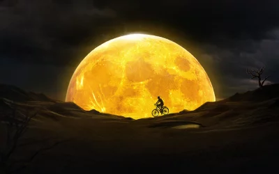 Lone Cyclist Riding Towards Massive Orange Celestial Body at Night image