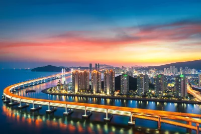 Busan City Nightscape: Illuminated Gwangan Bridge and Modern Skyline at Sunset image