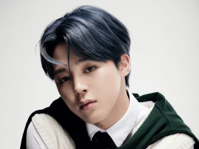 Captivating Young Man with Blue Hair in Green and Cream Fashion Posing Confidently image