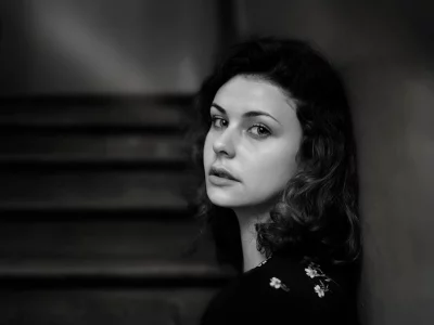Pensive Young Woman with Intense Gaze in Monochrome Portrait image