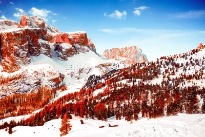 Majestic Winter Mountain Landscape with Snow Capped Peaks and Autumnal Trees Cinematic Wallpaper image