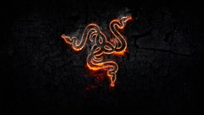 Intense Fiery Razer Logo with Glowing Outline on Dark Cracked Background image