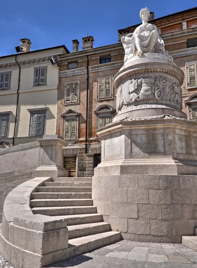 Grand Stone Statue and Curved Steps in Historic European City Square image