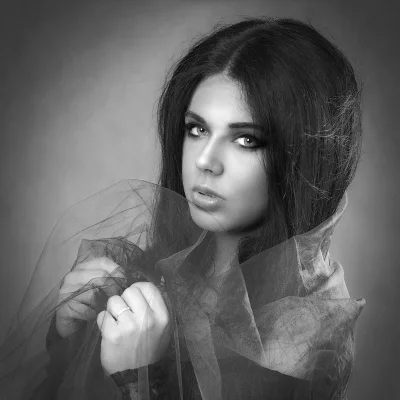 Artistic Black and White Portrait of Young Woman with Long Hair and Expressive Gaze 7584 image