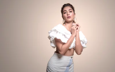 Pooja Hegde in Ruffled White Top and Gingham Pants Striking Elegant Pose image