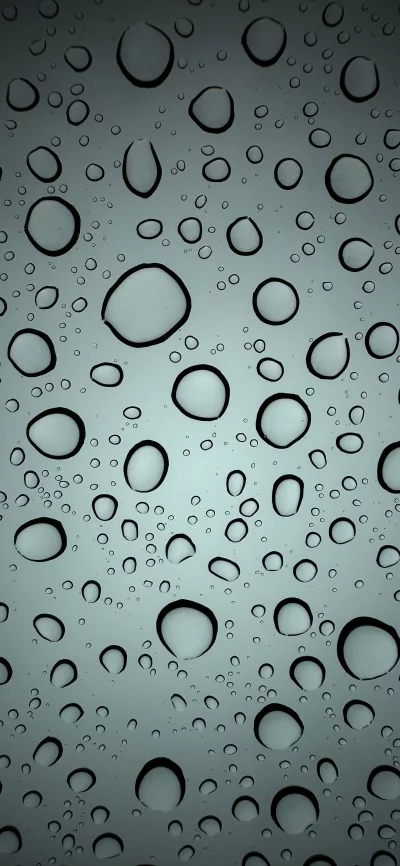 Close-up macro view of water droplets on glass surface