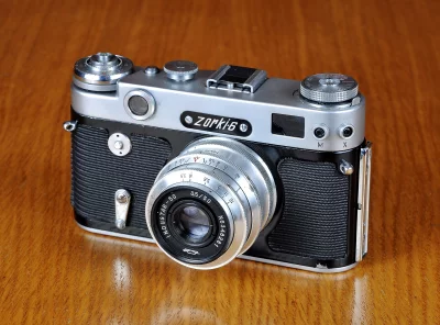 Vintage Zorki-6 Rangefinder Camera on Polished Wooden Surface image