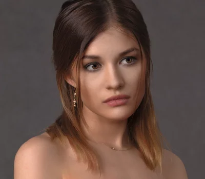 Captivating Portrait of a Pensive Young Woman with Brown Eyes and Bare Shoulders image