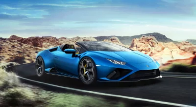 Blue Lamborghini Huracán Evo Spyder Driving Desert Road at Speed image