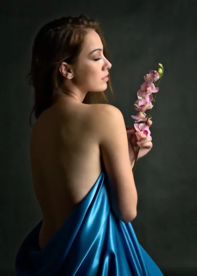 Elegant Woman with Closed Eyes, Blue Satin and Delicate Orchids image