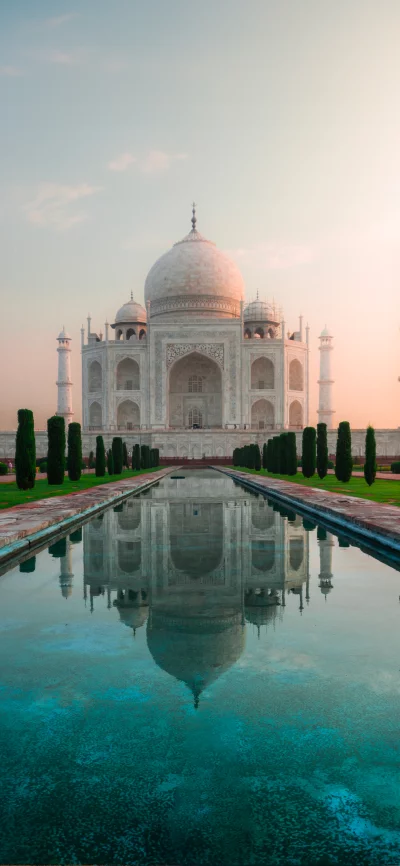 Iconic Taj Mahal Reflection at Sunrise with Serene Water Pool