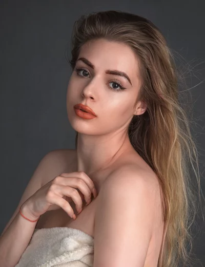 Beautiful Young Woman with Blonde Hair and Elegant Makeup Portrait image
