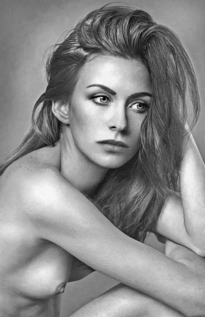 Pensive Bare-Shouldered Woman with Long Wavy Hair Black and White Portrait image