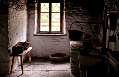 Rustic Stone Kitchen with Hanging Cauldron, Sunlight Interior image