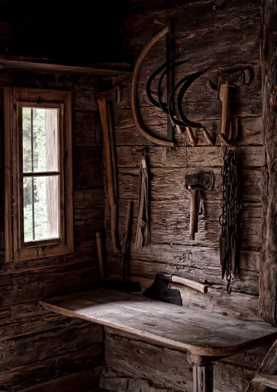 Rustic Old Workshop with Vintage Farm Tools and Wooden Workbench image