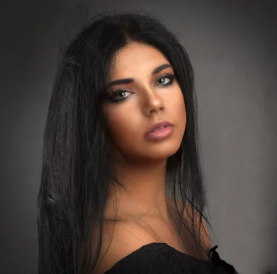 Captivating Portrait of Young Woman with Dark Hair and Expressive Eyes image