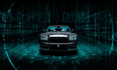 Black Rolls-Royce in Futuristic Digital World with Blue Neon Lights image