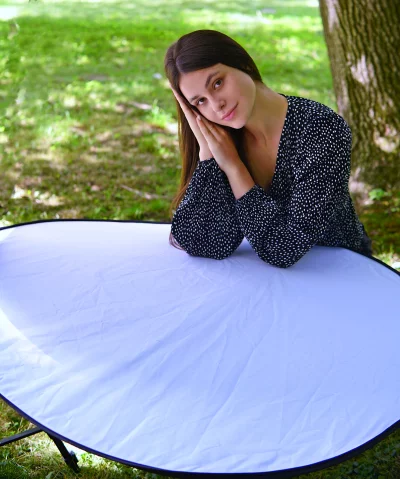 Young Woman Posing with Reflector in Polka Dot Dress Outdoor Portrait image