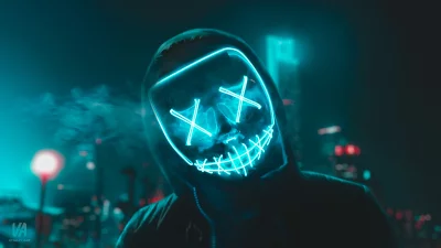 Mysterious Neon Purge Mask with Blue Glow in Dark Urban Night Scene image