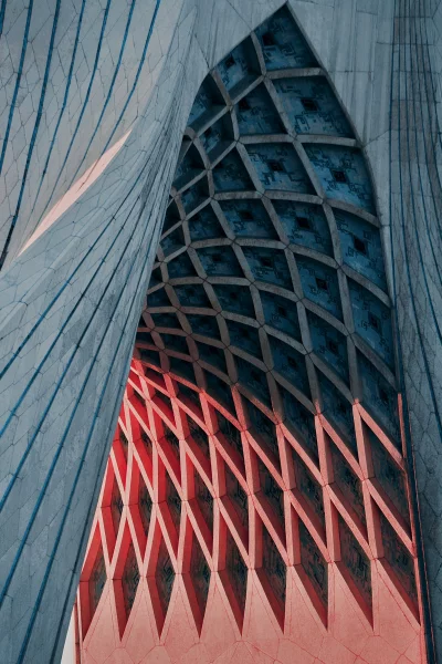 Intricate architectural design with geometric patterns and red lighting