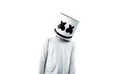 Person in White DJ Marshmello-Style Helmet and Long-Sleeve Shirt on Isolated Background image