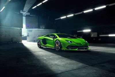 Exotic Green Lamborghini Supercar Parked in Spacious Industrial Hangar Interior image
