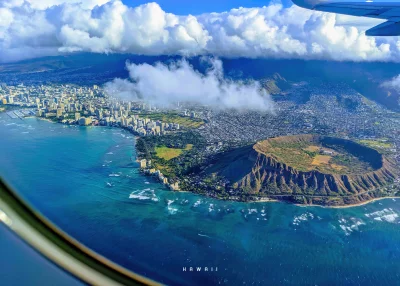 Aerial View of Honolulu City, Waikiki Beach, and Iconic Diamond Head Crater from Airplane Window in Hawaii image
