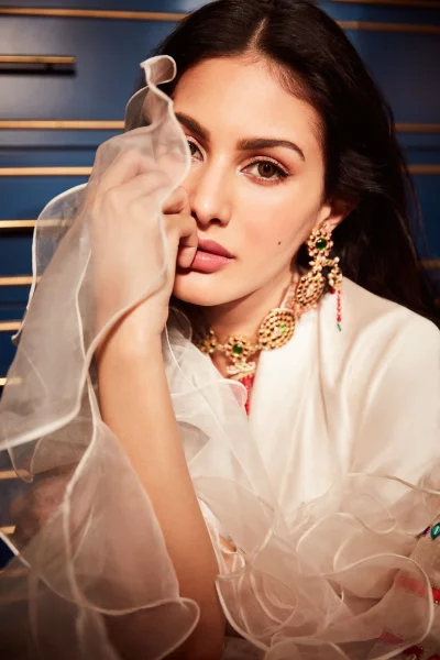 Beautiful Woman Adorned in Traditional Gold and Emerald Indian Jewelry image