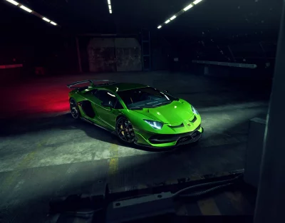 Luxury Green Lamborghini Aventador with Dramatic Lighting in Industrial Setting image