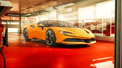 Stunning Orange Ferrari SF90 Supercar Parked Inside a Modern Garage Showroom image