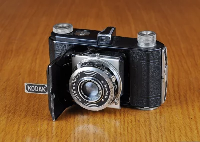 Vintage Kodak Retina Folding Camera on Classic Wooden Table image