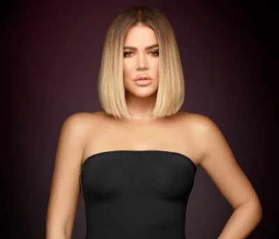 Confident Khloé Kardashian Posing with Blonde Bob Hair and Striking Green Eyes image