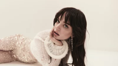 Elegant Woman in Sequined Outfit and Cozy Knit Sweater, Studio Portrait image