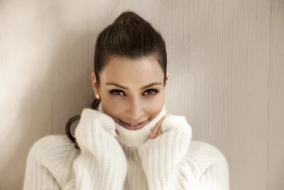 Radiant Woman Posing in Plush White Turtleneck Sweater with Bright Eyes image