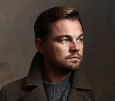 Leonardo DiCaprio's Intense Gaze in Stylish Green Coat and Grey Sweater image
