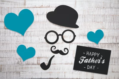Festive Father's Day Composition with Blue Hearts and Gentleman Silhouettes image