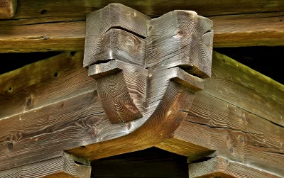 Rustic Wooden Corner Joint with Intricate Grain Patterns from an Aged Timber Structure image