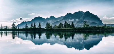 Majestic Alpine Peaks Reflected in Serene Mountain Lake image