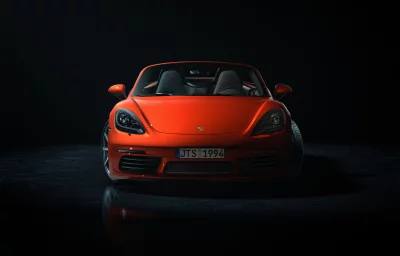 Sleek Orange Porsche 718 Boxster Luxury Sports Car in a Dark Studio image