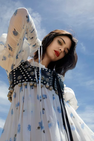 Young Woman Posing Elegantly in Bohemian Peasant Dress with Ornate Corset image